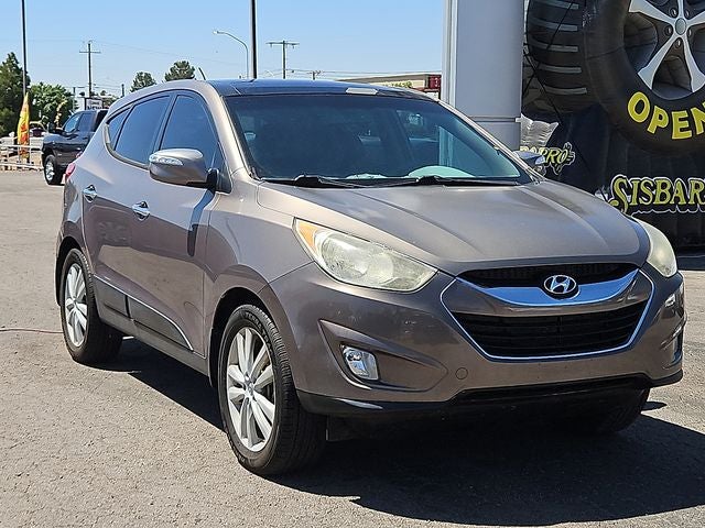 2013 Hyundai Tucson Limited in Chai Bronze — front three-quarter view